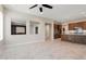 Open concept kitchen with rich cabinetry, granite countertops, and stainless steel appliances at 16953 W Merrell St, Goodyear, AZ 85395