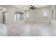 Airy living room with tile flooring and a view of the covered patio at 16953 W Merrell St, Goodyear, AZ 85395