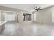 Bright and spacious living room featuring tile flooring and neutral paint at 16953 W Merrell St, Goodyear, AZ 85395