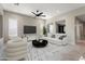 Modern living room with stylish furnishings, sleek flooring, and abundant natural light at 16953 W Merrell St, Goodyear, AZ 85395
