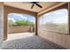 Covered patio area with desert views and retractable screen at 16953 W Merrell St, Goodyear, AZ 85395