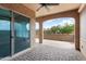 Open patio with ceiling fan, desert landscaping, and exterior archways at 16953 W Merrell St, Goodyear, AZ 85395