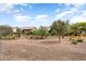 A picturesque view of homes in the neighborhood showing the desert landscaping and blue skies at 16953 W Merrell St, Goodyear, AZ 85395