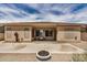 Well-maintained backyard with gravel, cactus and extended patio space perfect for outdoor entertaining at 17773 W Manso St, Goodyear, AZ 85338