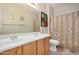 Bright bathroom featuring a double sink vanity, neutral paint and well-lit mirrors at 17773 W Manso St, Goodyear, AZ 85338