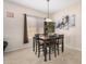 The dining room showcases a classic table set, artwork, and ample space for entertaining at 17773 W Manso St, Goodyear, AZ 85338