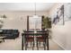 Cozy dining area offering comfortable seating and natural light with views into the living room at 17773 W Manso St, Goodyear, AZ 85338