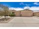 Charming single-story home featuring a three-car garage, desert landscaping, and a welcoming entrance at 17773 W Manso St, Goodyear, AZ 85338