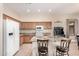 Inviting kitchen with granite countertops, stainless steel appliances, and ample cabinet space at 17773 W Manso St, Goodyear, AZ 85338