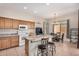 Well-appointed kitchen featuring granite countertops, modern appliances, and a convenient breakfast bar at 17773 W Manso St, Goodyear, AZ 85338