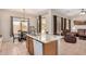 Bright kitchen with granite countertops, stainless steel appliances, and open access to a dining area at 17773 W Manso St, Goodyear, AZ 85338