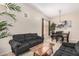 Bright living room featuring contemporary decor, soft carpet, and natural light at 17773 W Manso St, Goodyear, AZ 85338