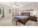 Spacious main bedroom suite featuring a king-size bed, ensuite bathroom, and neutral paint for a warm and inviting ambiance at 17773 W Manso St, Goodyear, AZ 85338