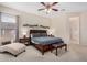 Inviting main bedroom with king bed, ceiling fan, accent furniture, and bedside tables, offering a relaxing retreat at 17773 W Manso St, Goodyear, AZ 85338