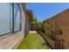 Charming outdoor space with artificial grass, brick-lined flower bed and privacy wall at 18002 N 12Th St # 45, Phoenix, AZ 85022
