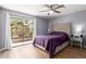 Cozy bedroom with sliding glass doors that lead to a private outdoor space and ample natural light at 18002 N 12Th St # 45, Phoenix, AZ 85022