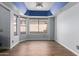 Bright dining room with hardwood floors, blue ceiling, and natural light at 18002 N 12Th St # 45, Phoenix, AZ 85022
