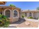Inviting walkway leading to arched windows and landscaped yard at 18002 N 12Th St # 45, Phoenix, AZ 85022