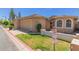 Charming single-story home with a well-manicured lawn and two-car garage at 18002 N 12Th St # 45, Phoenix, AZ 85022