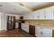 Well-lit kitchen featuring stainless steel appliances, white cabinets, and granite countertops at 18002 N 12Th St # 45, Phoenix, AZ 85022