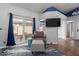 Relaxing living area with sliding door, hardwood floors and vaulted ceilings at 18002 N 12Th St # 45, Phoenix, AZ 85022