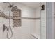 Modern tiled shower with built-in niches and a sleek showerhead at 18002 N 12Th St # 45, Phoenix, AZ 85022