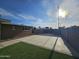 The backyard of the home features a concrete patio, brick, and artificial grass at 1904 E Jarvis Ave, Mesa, AZ 85204
