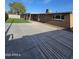 This backyard is complete with a covered patio, artificial turf, and ample space for relaxation and entertainment at 1904 E Jarvis Ave, Mesa, AZ 85204