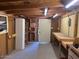 Unfinished basement with concrete flooring, exposed beams and door access at 1904 E Jarvis Ave, Mesa, AZ 85204