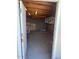 Spacious unfinished basement with concrete block wall and exposed beam ceiling at 1904 E Jarvis Ave, Mesa, AZ 85204