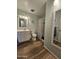 Well-lit bathroom with a vanity, toilet, and shower/tub combination at 1904 E Jarvis Ave, Mesa, AZ 85204