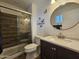 Updated bathroom featuring a tiled shower with glass door and modern vanity at 1904 E Jarvis Ave, Mesa, AZ 85204
