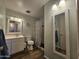 Bright bathroom featuring a vanity, toilet, and shower-tub combination with stylish accents at 1904 E Jarvis Ave, Mesa, AZ 85204