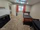 A cozy bedroom featuring soft carpet, natural light, and simple furnishings, perfect for relaxation at 1904 E Jarvis Ave, Mesa, AZ 85204