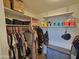 Organized closet with shelving, clothing rack, and storage container at 1904 E Jarvis Ave, Mesa, AZ 85204