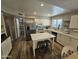 Bright updated kitchen features stainless steel appliances, an island, and a pantry at 1904 E Jarvis Ave, Mesa, AZ 85204