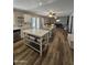 Open concept kitchen with center island flows into the dining and living areas, creating a welcoming space at 1904 E Jarvis Ave, Mesa, AZ 85204