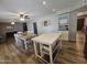 Open-concept kitchen and dining area featuring a central island, modern cabinetry, and a spacious layout at 1904 E Jarvis Ave, Mesa, AZ 85204