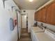 Functional laundry area with a washer, dryer, and cabinets for storage, making chores easier at 1904 E Jarvis Ave, Mesa, AZ 85204