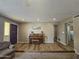 Comfortable living room features a piano and flows into other rooms, providing a welcoming atmosphere at 1904 E Jarvis Ave, Mesa, AZ 85204