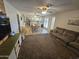 Spacious open-concept living room showcasing seamless flow to the kitchen and dining areas at 1904 E Jarvis Ave, Mesa, AZ 85204