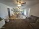 Spacious living room seamlessly connects to kitchen and dining areas, ideal for modern living and entertaining at 1904 E Jarvis Ave, Mesa, AZ 85204