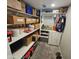 Walk-in closet with shelves and built-in storage, providing ample space for organization at 1904 E Jarvis Ave, Mesa, AZ 85204