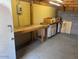 Spacious workshop with workbench and pegboard paneling offering room for projects and organization at 1904 E Jarvis Ave, Mesa, AZ 85204