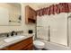 Bathroom with granite countertops, wood vanity and a shower and tub combo at 1917 E Lindrick Dr, Chandler, AZ 85249