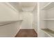 Walk in closet with custom shelving offering ample storage space at 1917 E Lindrick Dr, Chandler, AZ 85249