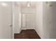 Bright entryway with a dark wood floor, white walls, and view of the front door at 1917 E Lindrick Dr, Chandler, AZ 85249
