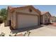 Charming single-story home with desert landscaping and a large two car garage at 1917 E Lindrick Dr, Chandler, AZ 85249