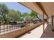 Covered patio featuring desert landscaping views, brick siding and black iron decorative fence at 1917 E Lindrick Dr, Chandler, AZ 85249