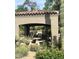 Outdoor BBQ area with a built-in grill, stone countertops, and ample seating for entertaining guests at 19550 N Grayhawk Dr # 2023, Scottsdale, AZ 85255
